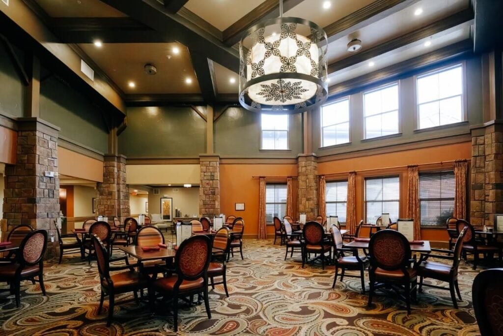 Elegant Dining Room With Chandelier at Assisted Living Facility