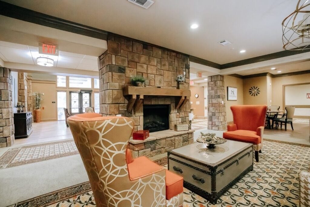 Spacious Common Area With Stone Fireplace at Assisted Living Kingwood TX