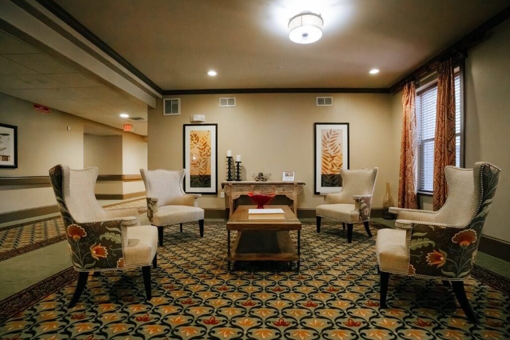 Cozy Living Room Area With Fireplace at Skilled Nursing Facility