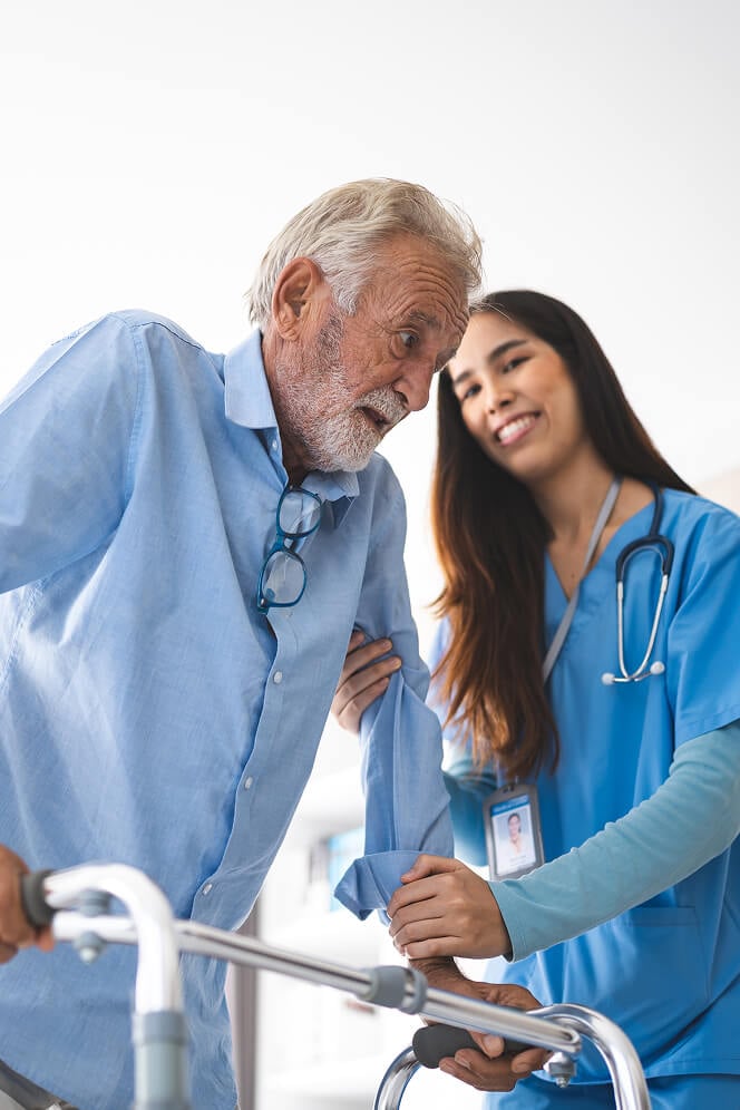 Nurse Comforting Elderly Woman at Nursing Home Oxford