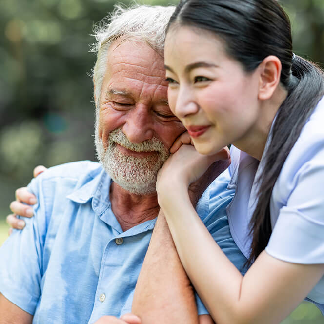 Caregiver Comforting Resident at Assisted Living Facility