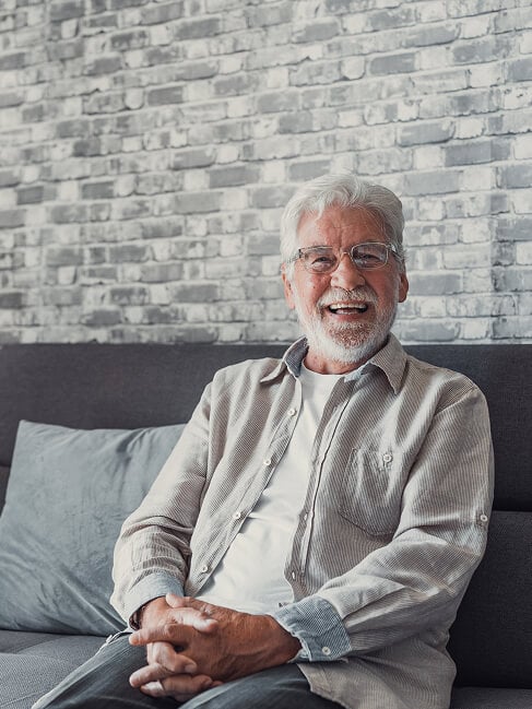 Elderly Man Smiling at Nursing Home in Oxford